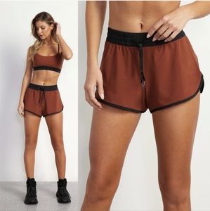 Stori Intro Sports Bra and Challenge Short Set in Brandy And Onyx